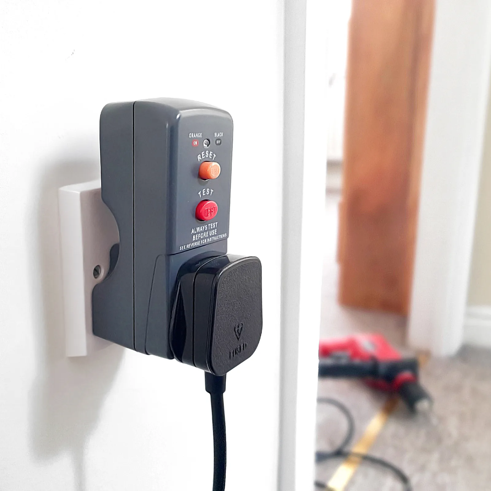 RCD plug adaptor beside DIY tools in a London flat